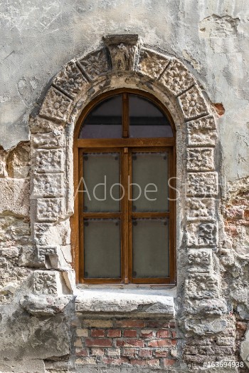 Picture of Old window on ancient wall